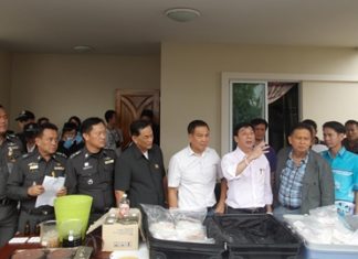 Police put out for display suitcases full of drugs, along with chemicals and drug making equipment during the raid.